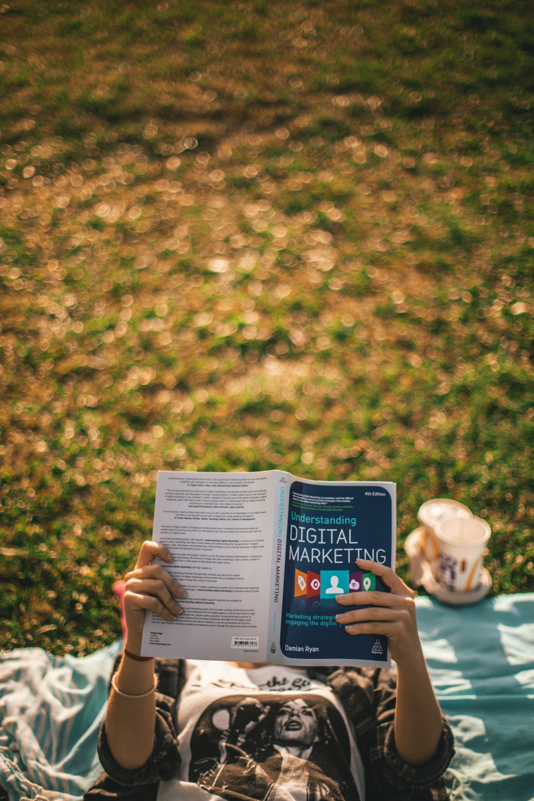 The Art of Drawing Readers In: Your attractive post title goes here Girl reading a book about Digital Marketing